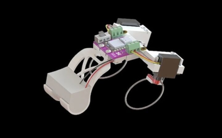 Tiny Frog-Like Robot Hops and Swims Using Snapping Elastic Limbs
