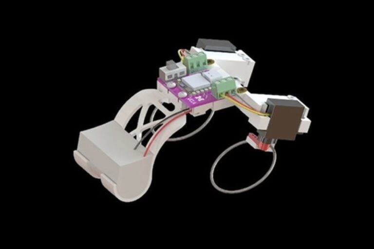 Tiny Frog-Like Robot Hops and Swims Using Snapping Elastic Limbs